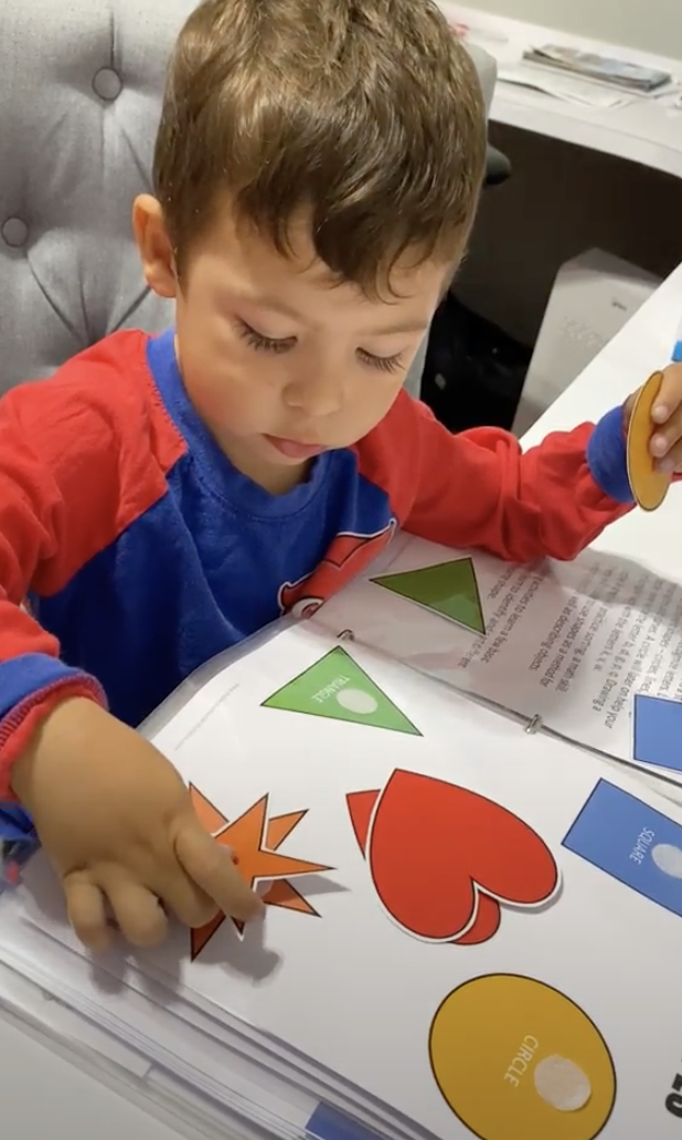 Shapes activity page from the Learning Binder — circle, square, triangle, star matching